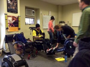 Troy using General Purpose aid to hold onto ERG machine. Adaptive gym equipment. Suitable for reduced hand function: tetra, quad, cerebral palsy, SCI, spinal cord injury, limb difference, stroke and more.