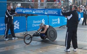 Rob wheelchair racing in Dubai marathon