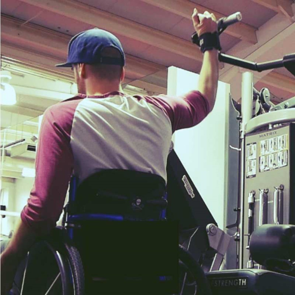 Ben Clark using Looped aids in gym. Adaptive gym equipment. Suitable for reduced hand function: tetra, quad, cerebral palsy, SCI, spinal cord injury, stroke and more.