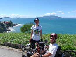 Rob and Jo bike riding. Rob using Looped aids to hold handbike handles