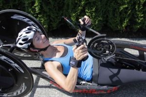 Michelle Stilwell using Looped aids on handbike. Adaptive gym equipment. Suitable for reduced hand function: tetra, quad, cerebral palsy, SCI, spinal cord injury, limb difference, stroke and more.