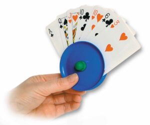 a card holder with a fan of playing cards being held by a hand