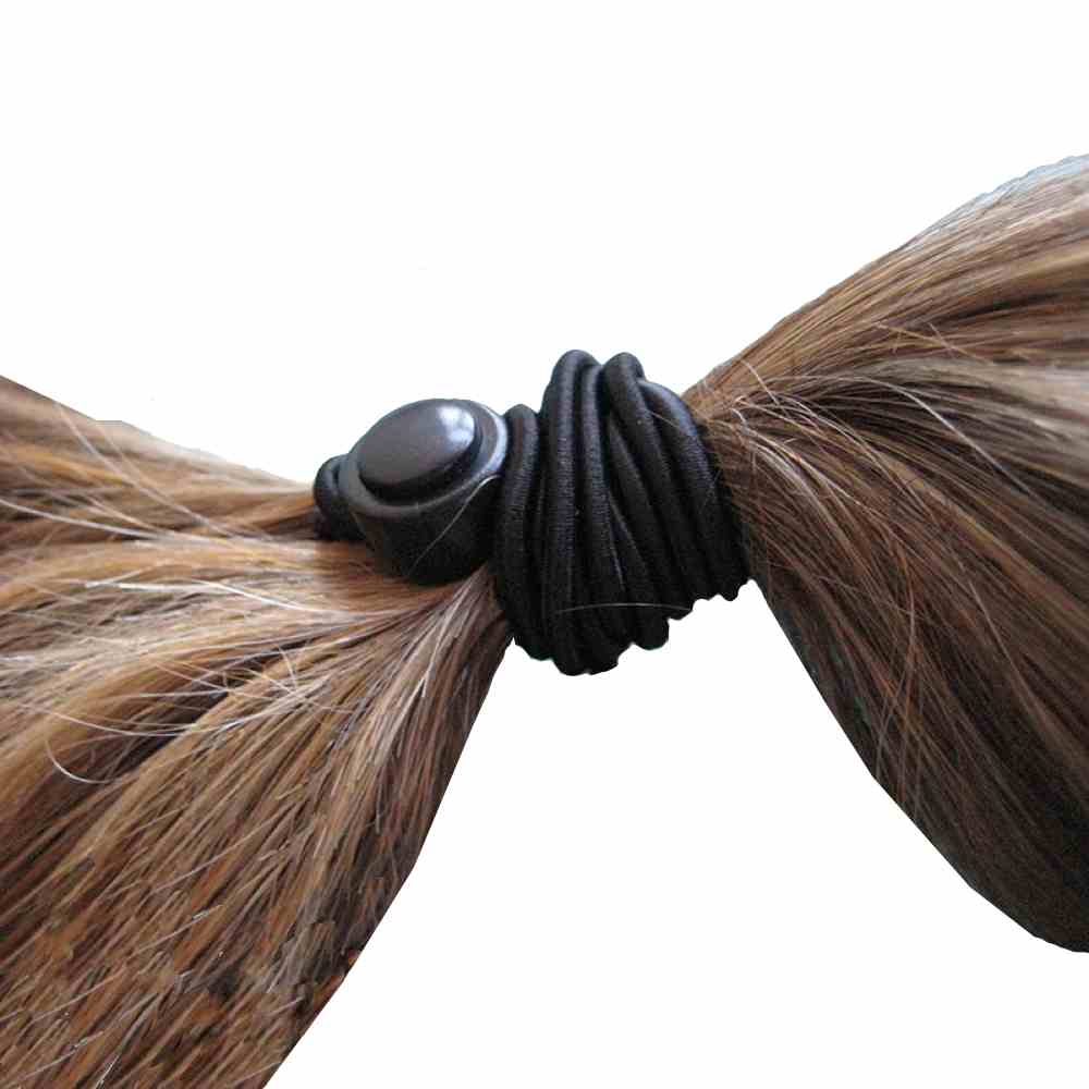 image shows a close up of hair in a ponytail, secured by the 1-up hair tie.
