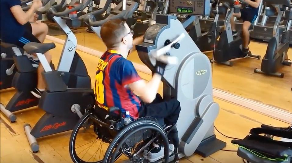 Gareth on handbike. Adaptive gym equipment. Suitable for reduced hand function: tetra, quad, cerebral palsy, SCI, spinal cord injury, stroke and more.