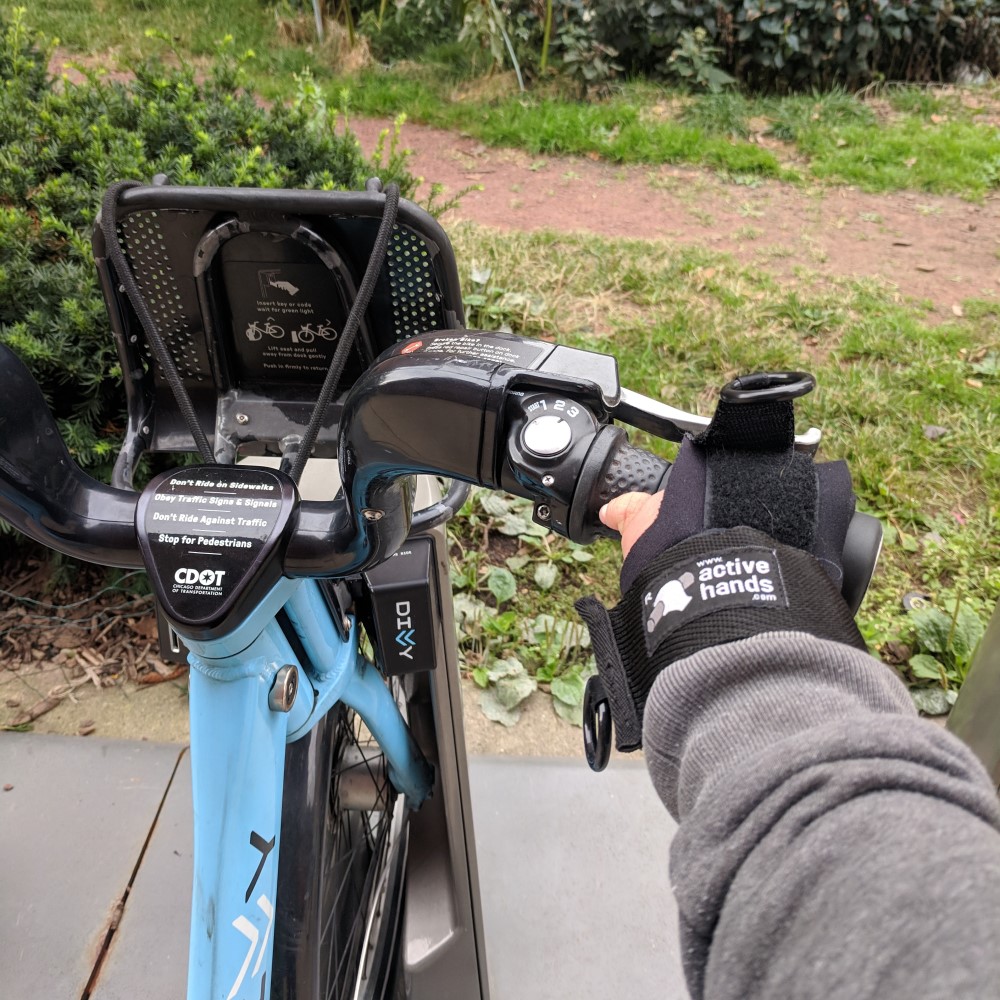 Limb Difference aid holding bike handle.