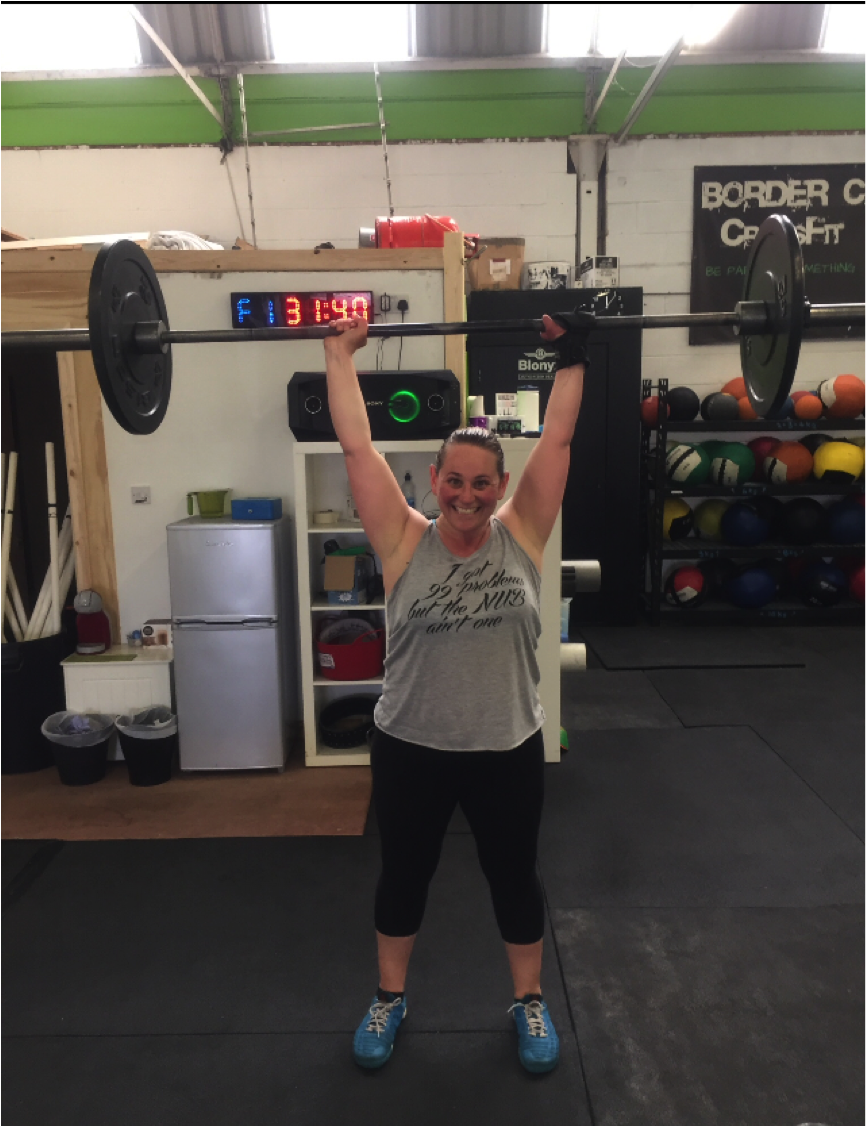 Tina weightlifting with Limb Difference aid