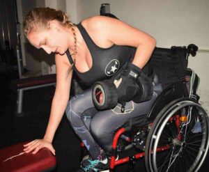 Alex using General Purpose aid in gym. Adaptive gym equipment. Suitable for reduced hand function: tetra, quad, cerebral palsy, SCI, spinal cord injury, stroke and more.
