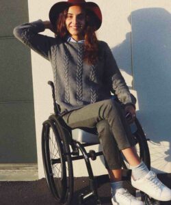 Oksana wearing hat in wheelchair