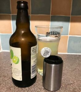 Automatic bottle opener used to open cider. Adaptive kitchen equipment. Suitable for reduced hand function: tetra, quad, cerebral palsy, SCI, spinal cord injury, stroke and more.