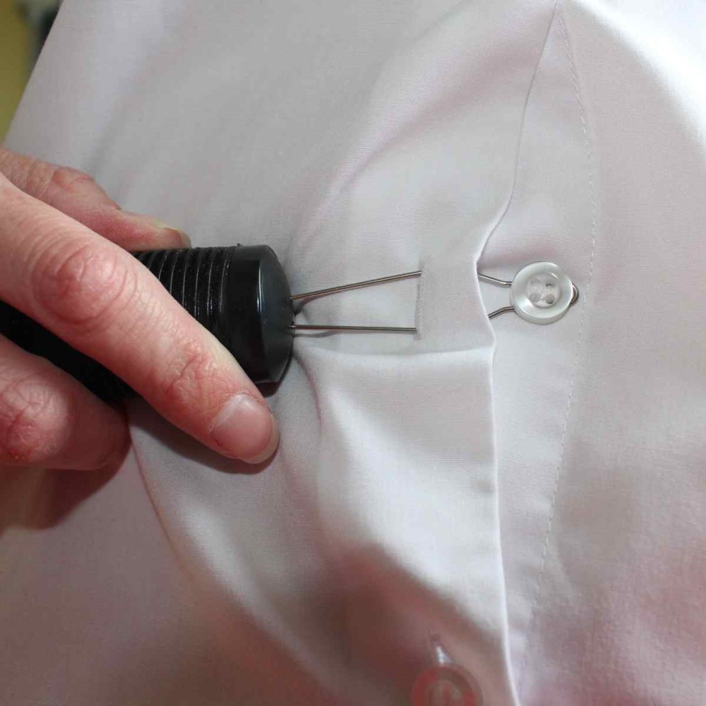 Button puller doing up button on white shirt. Suitable for reduced hand function: tetra, quad, cerebral palsy, SCI, spinal cord injury, stroke and more.