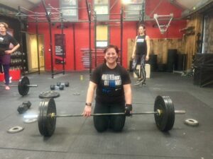 Tina weightlifting with Limb Difference aid