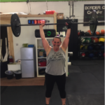 Tina weight lifting with a limb difference aid