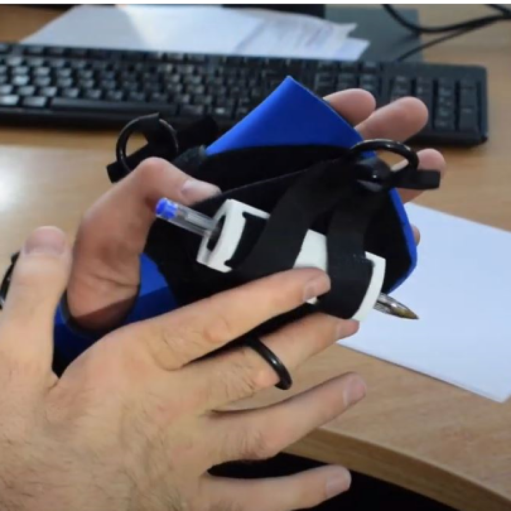 link to video of small item gripping aid for those who can't grasp pens, make-up, toothbrush, etc. Suitable for reduced hand function: tetra, quad, cerebral palsy, SCI, spinal cord injury, stroke and more.