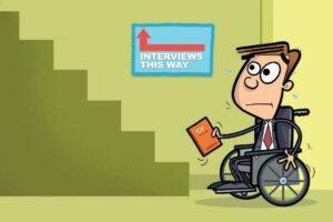 picture of man in wheelchair sweating, looking at some stairs with an arrow pointing up reading "interviews this way"