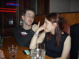 a very young Gareth sticking his middle finger up at a girl. I wonder what she said?