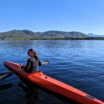 Jillian Kayaking with gripping aids on oar.