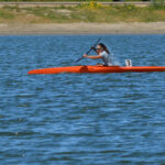 Jillian Kayaking with gripping aids on oar.