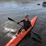 Jillian Kayaking with gripping aids on oar.