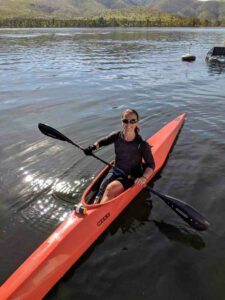 Jillian Kayaking with gripping aids on oar.