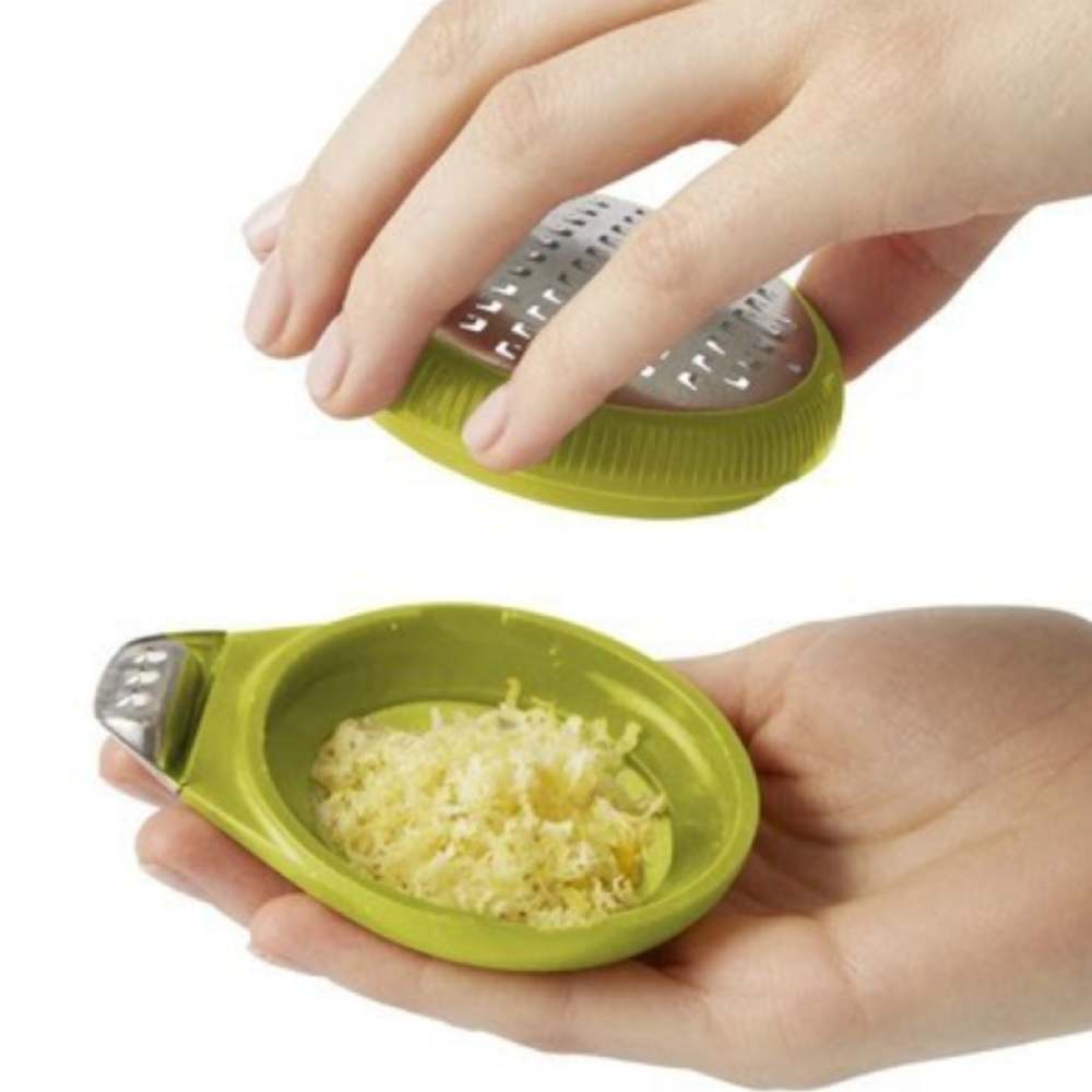 Palm zester with lemon zest. Adaptive kitchen equipment. Suitable for reduced hand function: tetra, quad, cerebral palsy, SCI, spinal cord injury, stroke and more.
