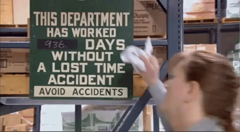 gif of lady clearing days with accident sign