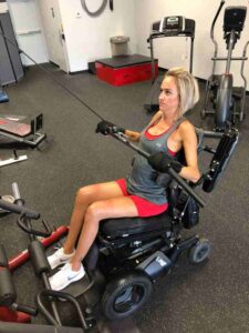 weight machine being used by lady with General Purpose gripping aids