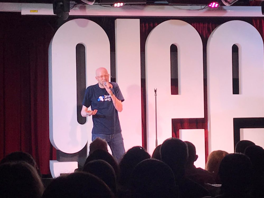 Curtis performing his comedy set at the Birmingham glee club