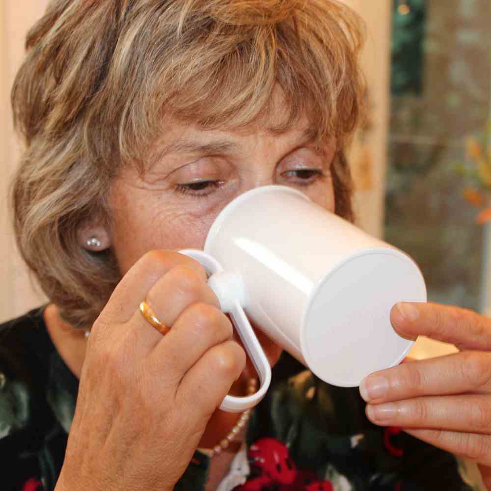 tip the mug with your hand or against your mouth