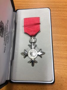 An MBE medal in its display box