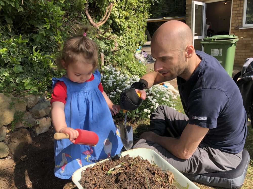 Rob and his daughter gardening together