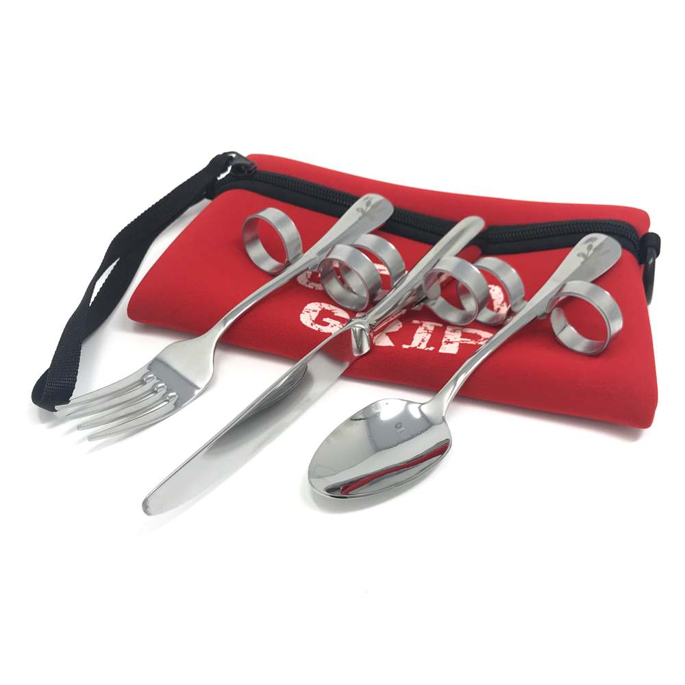 a knife, fork and spoon with loops for your finger and thumb, to help you hold them, are sat on a red storage pouch
