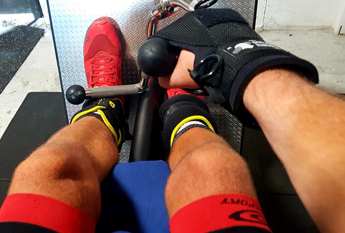 Steph uses his general purpose gripping aid on a rowing machine
