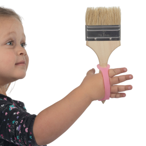 Girl using pink EazyHold to hold a paintbrush