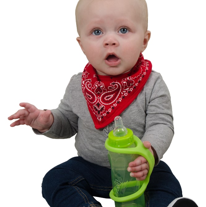 Image shows a baby sitting up and holding onto a drinking bottle which has an eazyhold strap on it.