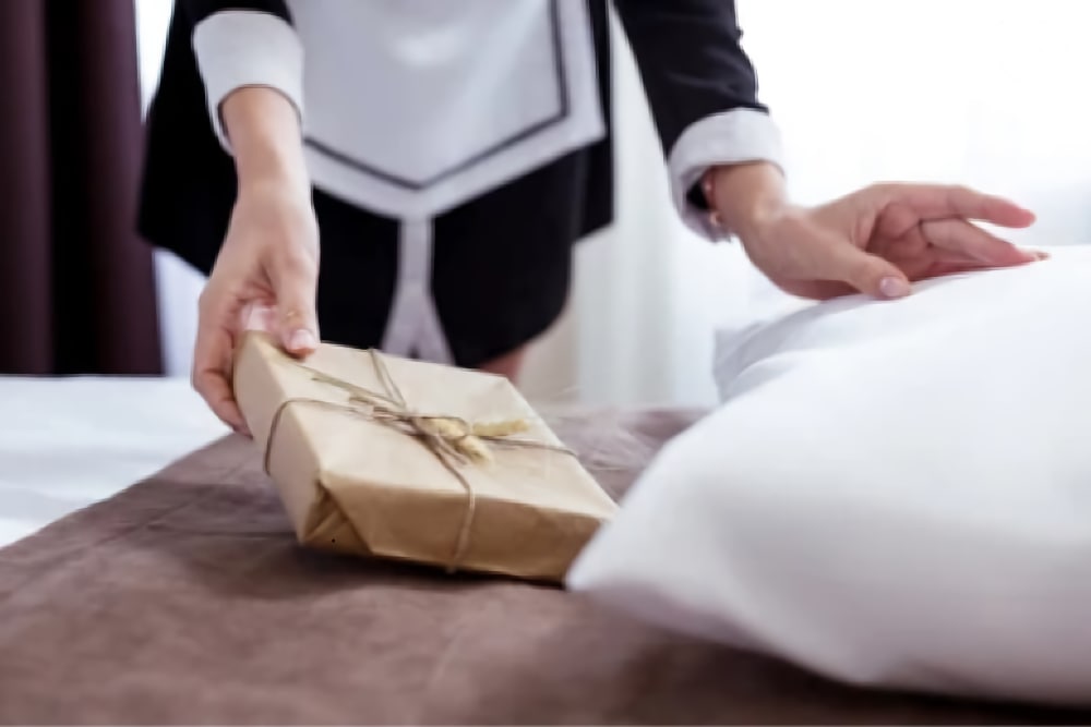 Lady putting present under a pillow
