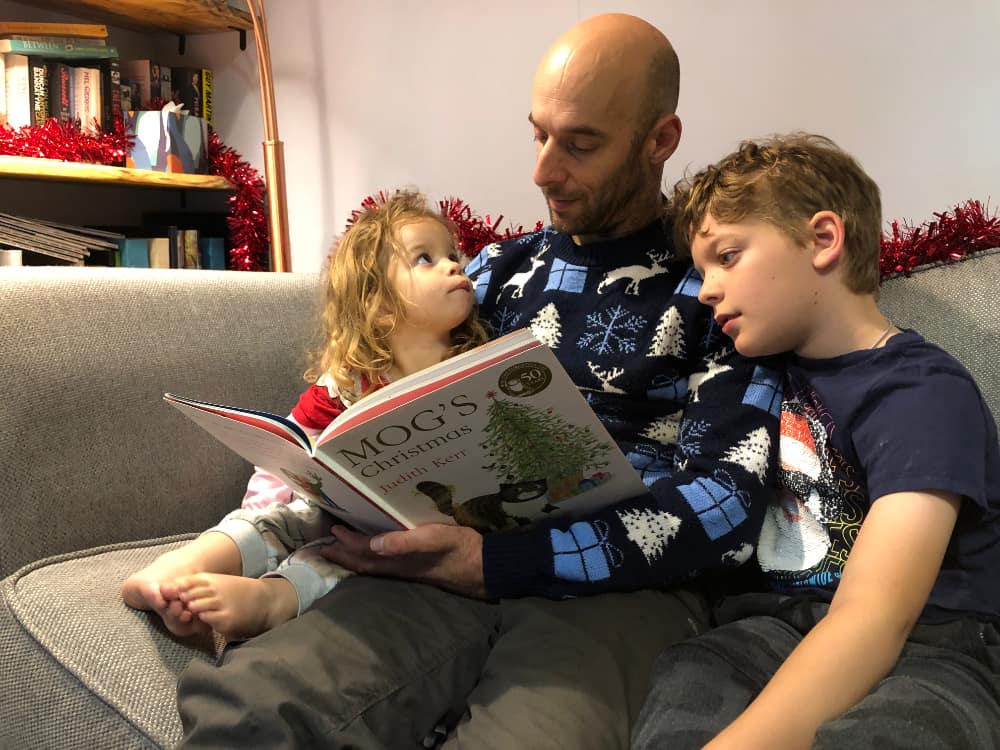 Rob reads Christmas stories to his children