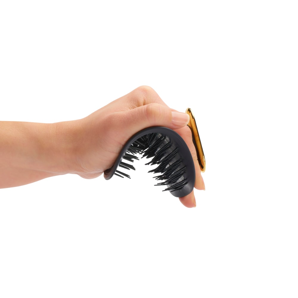The flexible hair brush fits your hand whatever your disability