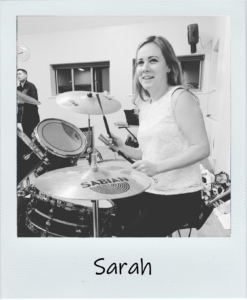 sarah active hands staff member playing drums