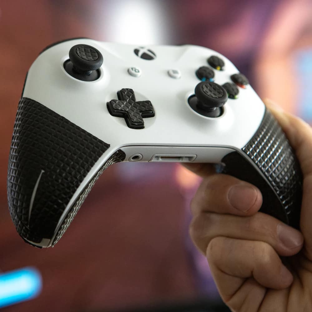 the xbox controller gaming grip has non-slip stickers for the cross button and the joysticks