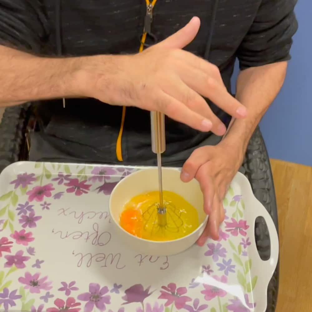 Rob shows how the push whisk can be used to scramble eggs.