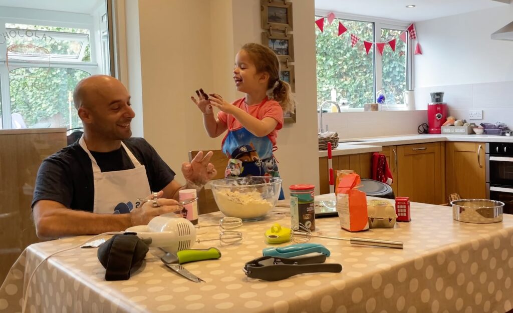 Rob and 3-year-old Xanthe baking a cake