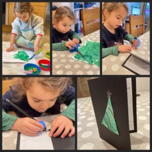 Girl makes a Christmas tree card using Active Hands gadgets