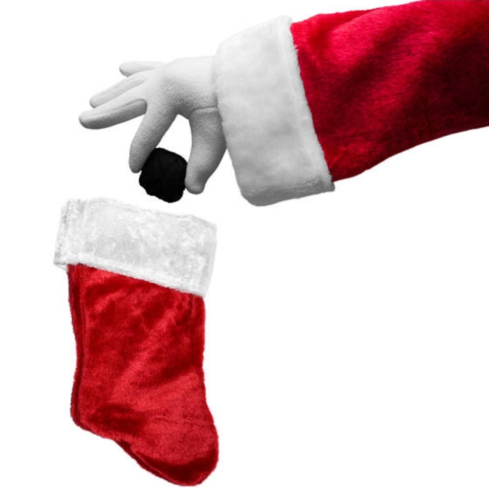 Santa hand putting coal in stocking