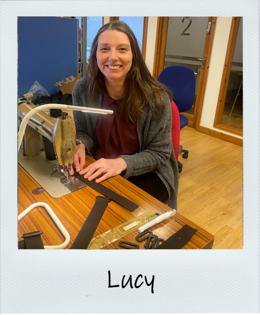 A polaroid picture of Lucy at the sewing machine