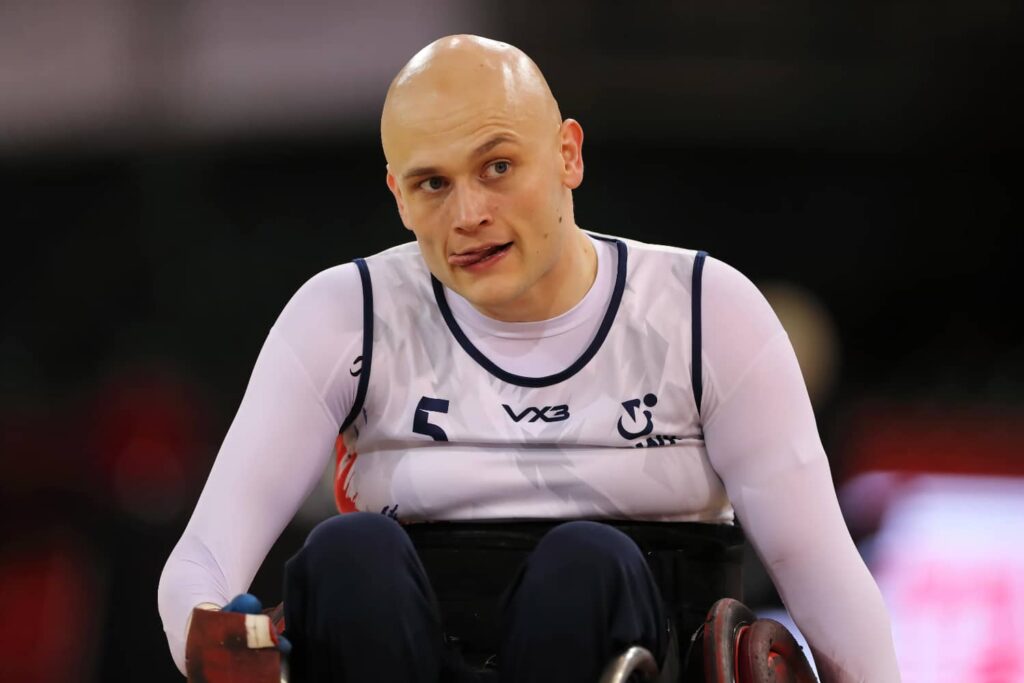 Paralympian Jack Smith playing wheelchair rugby with his tongue out! He shares his gym programme with us in this article.