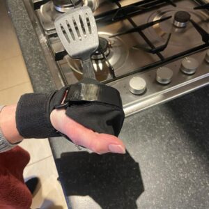 Lite aid being used in the kitchen to hold a fish slice