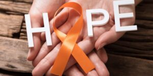MS awareness 'Hope' with the O replaced with the orange ribbon