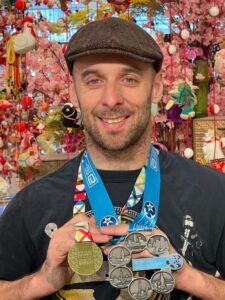 Rob with his Tokyo marathon medal and his six star marathon medal