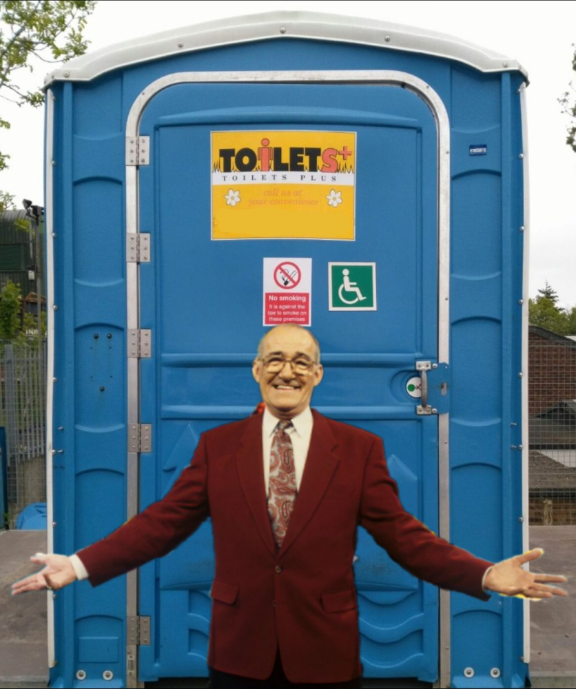 man stood presenting a portable disabled toilet cubicle