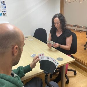 Rob and Mel play a card game using the flexi phone holder with the card holder
